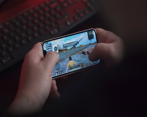 Angled smartphone showing the fictional Harbour Hybrid Crew team game